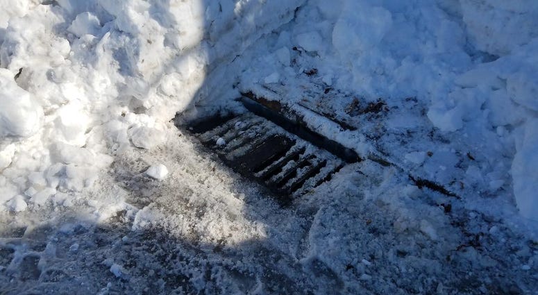 Snow was cleared from this storm drain Cleared storm drain