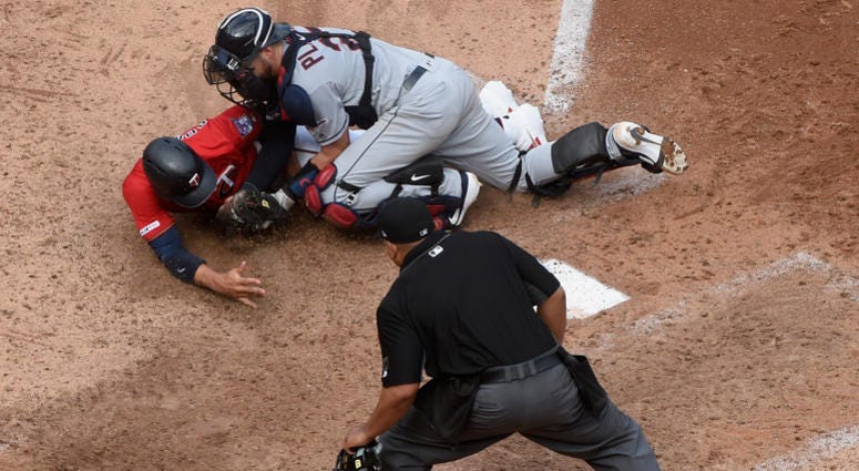 Adrianza is thrown out at home Indians throw out Adrianza at the plate