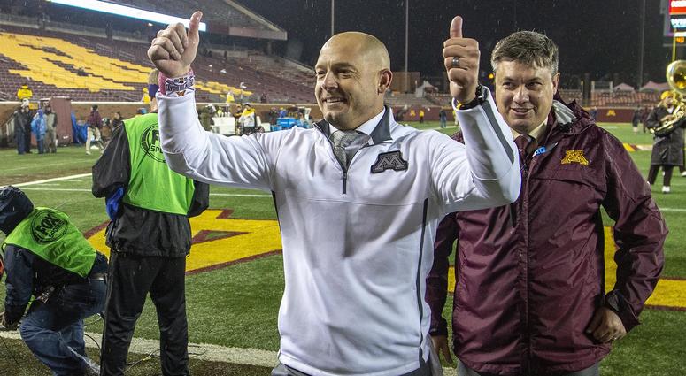 PJ Fleck celebrates Gopher football coach PJ Fleck is happy