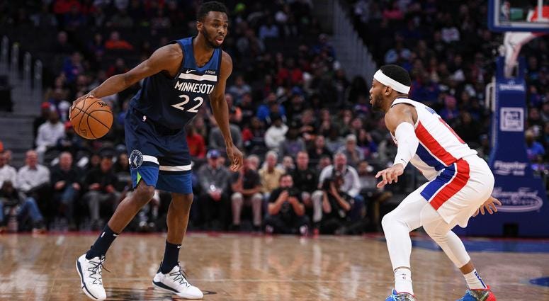 Nov 11, 2019; Detroit, MI, USA; Minnesota Timberwolves guard Andrew Wiggins (22) goes to the basket as Detroit Pistons guard Bruce Brown (6) defends during the first quarter at Little Caesars Arena.