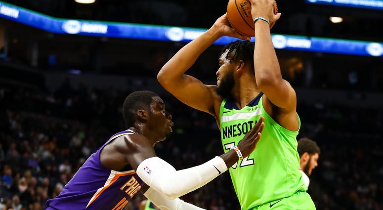 Cheick Diallo guards Karl-Anthony Towns Karl-Anthony Towns with the ball against Cheick Diallo