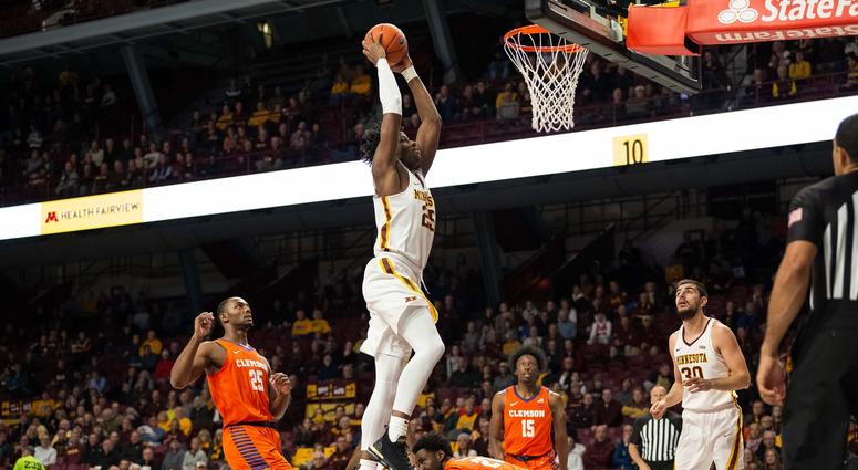 A dunk by Gopher center Daniel Oturu against Clemson Gopher center Daniel Oturu dunks