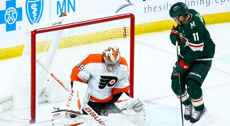 At the net it is Zach Parise and Carter Hart Carter Hart faces Zach Parise