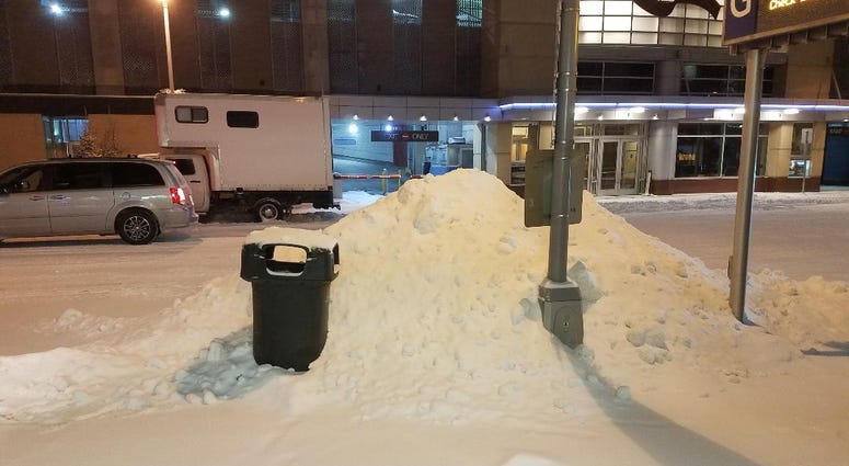 Snow piled on the sidewalk in downtown Minneapolis Heres some snow