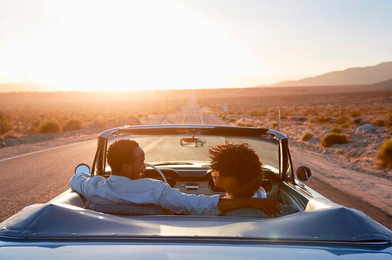 Rear View Of Couple On Road Trip Rear View Of Couple On Road Trip