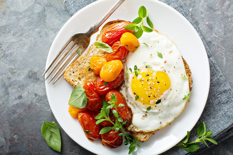 Photo of Multigrain toast with fried egg and roasted tomatoes