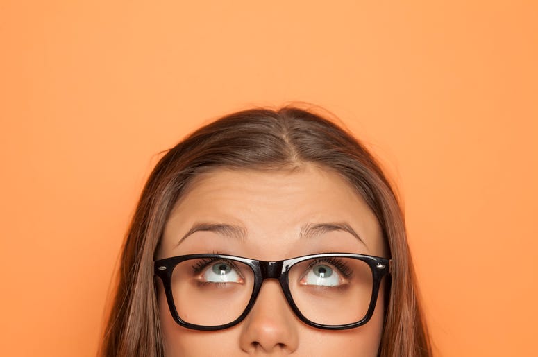 Woman in Glasses Staring Up