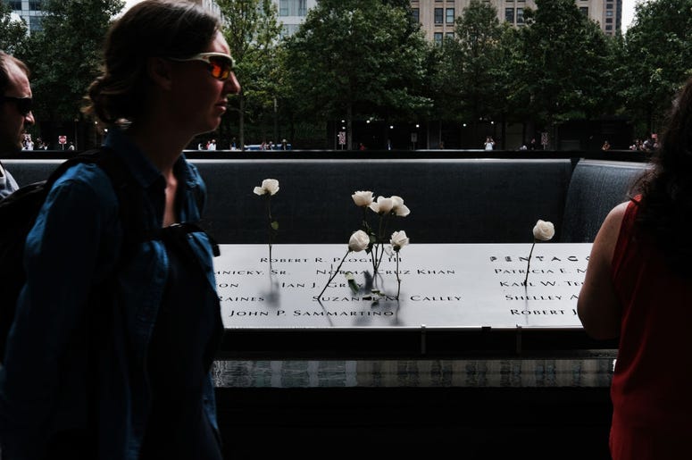 People walk on the grounds of the September 11 Memorial and Museum on September 05, 2019 in New York City. New York City is preparing to commemorate the 18th anniversary of the attacks on the World Trade Center in which 2,996 people were killed and over 6 People walk on the grounds of the September 11 Memorial and Museum on September 05, 2019 in New York City. New York City is preparing to commemorate the 18th anniversary of the attacks on the World Trade Center in which 2,996 people were killed and over 6