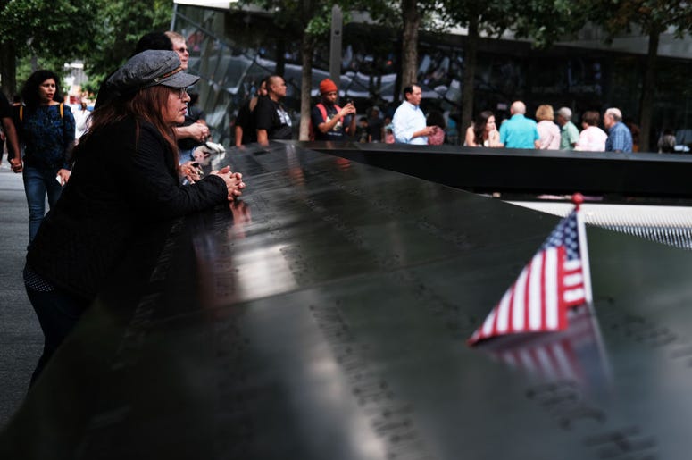 People walk on the grounds of the September 11 Memorial and Museum on September 05, 2019 in New York City. New York City is preparing to commemorate the 18th anniversary of the attacks on the World Trade Center in which 2,996 people were killed and over 6 People walk on the grounds of the September 11 Memorial and Museum on September 05, 2019 in New York City. New York City is preparing to commemorate the 18th anniversary of the attacks on the World Trade Center in which 2,996 people were killed and over 6