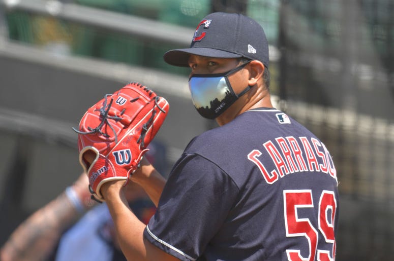 CLEVELAND, OHIO - JULY 06: Pitcher Carlos Carrasco #59 of the Cleveland Indians throws in the bullpen during summer workouts at Progressive Field on July 06, 2020 in Cleveland, Ohio. (Photo by Jason Miller/Getty Images)
