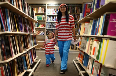 Woman and child in Waldo costumes