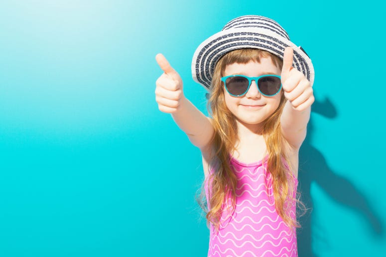 Little happy girl in beach outfit Little happy girl in beach outfit
