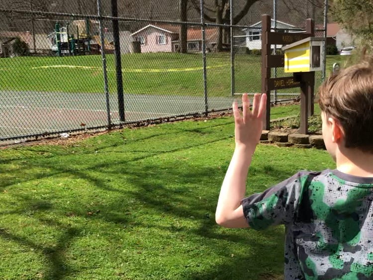 Child Walking Near Closed Playgound. LDG
