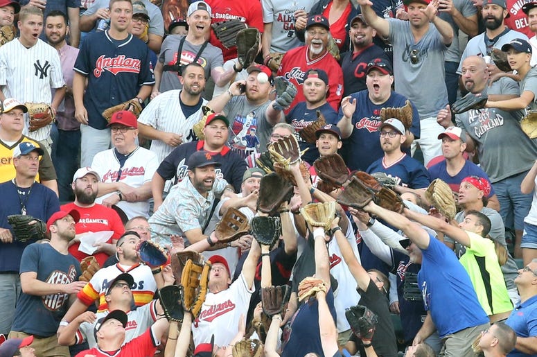 ans reach for a home run by Toronto Blue Jays third baseman Vladimir Guerrero Jr. (27) during the first round in the 2019 MLB Home Run Derby at Progressive Field. ans reach for a home run by Toronto Blue Jays third baseman Vladimir Guerrero Jr. (27) during the first round in the 2019 MLB Home Run Derby at Progressive Field.