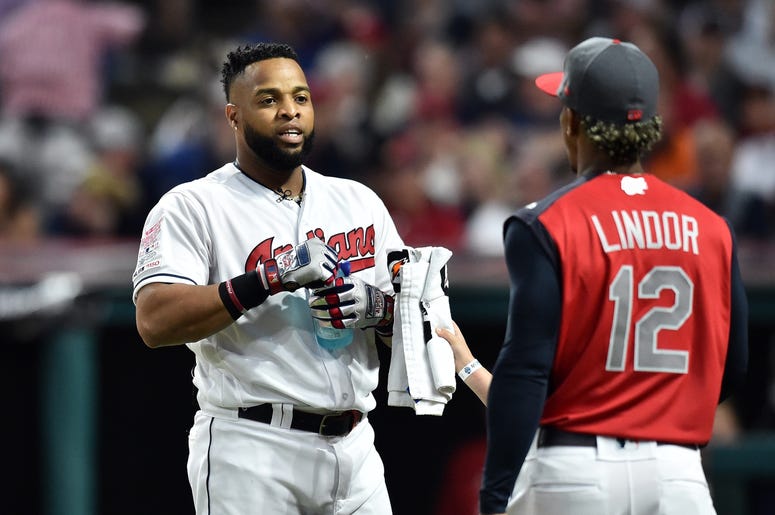 Cleveland Indians first baseman Carlos Santana (41) talks with teammate Francisco Lindor during the first round in the 2019 MLB Home Run Derby at Progressive Field. Cleveland Indians first baseman Carlos Santana (41) talks with teammate Francisco Lindor during the first round in the 2019 MLB Home Run Derby at Progressive Field.