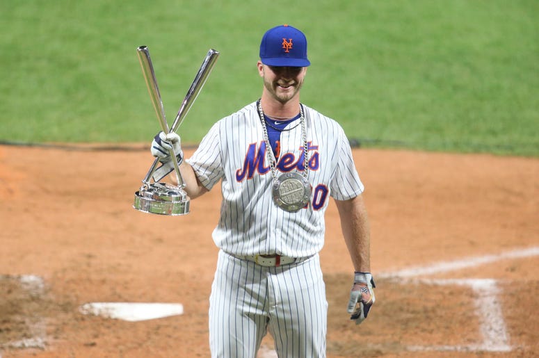 New York Mets first baseman Pete Alonso (20) holds the trophy after winning the 2019 MLB Home Run Derby at Progressive Field. New York Mets first baseman Pete Alonso (20) holds the trophy after winning the 2019 MLB Home Run Derby at Progressive Field.