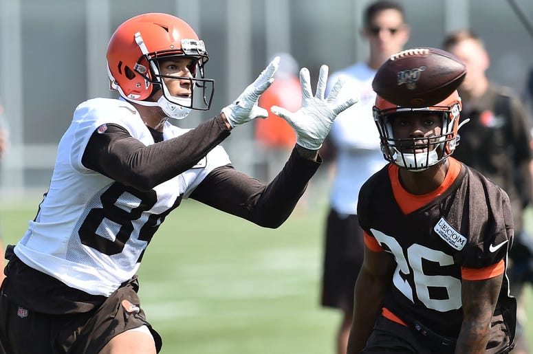 Cleveland Browns wide receiver Derrick Willies (84) catches a pass ahead of cornerback Greedy Williams (26) during training camp at the Cleveland Browns Training Complex. Cleveland Browns wide receiver Derrick Willies (84) catches a pass ahead of cornerback Greedy Williams (26) during training camp at the Cleveland Browns Training Complex.