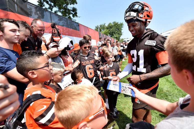 Cleveland Browns cornerback Denzel Ward (21) signs autographs after training camp at the Cleveland Browns Training Complex. Cleveland Browns cornerback Denzel Ward (21) signs autographs after training camp at the Cleveland Browns Training Complex.