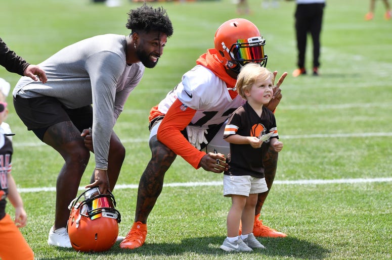 Cleveland Browns wide receiver Jarvis Landry (left) and wide receiver Odell Beckham (13) pose for a photo with a fan after training camp at the Cleveland Browns Training Complex. Cleveland Browns wide receiver Jarvis Landry (left) and wide receiver Odell Beckham (13) pose for a photo with a fan after training camp at the Cleveland Browns Training Complex.
