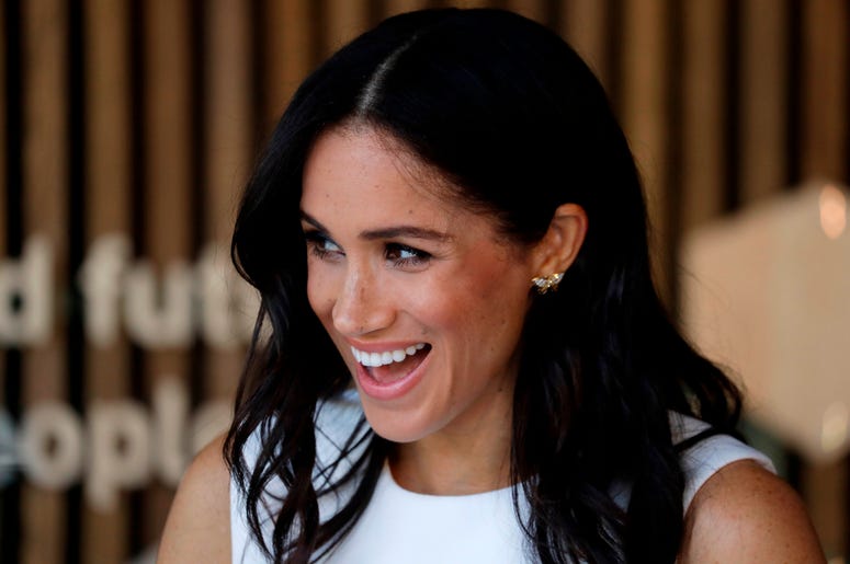 The Duchess of Sussex reacts during a ceremony at Taronga Zoo in Sydney, Australia. The Duchess of Sussex reacts during a ceremony at Taronga Zoo in Sydney, Australia.