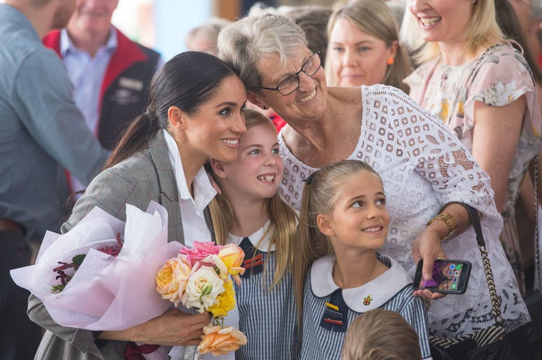 he Duchess of Sussex poses for a photo with members of the public at the naming and unveiling of a new Royal Flying Doctor Service aircraft at Dubbo City Regional Airport, in Dubbo, New South Wales, on the second day of the royal couple's visit to Austral he Duchess of Sussex poses for a photo with members of the public at the naming and unveiling of a new Royal Flying Doctor Service aircraft at Dubbo City Regional Airport, in Dubbo, New South Wales, on the second day of the royal couple's visit to Austral