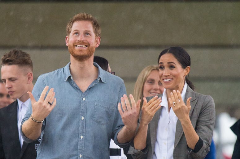 The Duke and Duchess of Sussex look out at a heavy downpour of rain during a visit to Clontarf Foundation and Girls Academy in Dubbo, New South Wales, on the second day of the royal couple's visit to Australia. The Duke and Duchess of Sussex look out at a heavy downpour of rain during a visit to Clontarf Foundation and Girls Academy in Dubbo, New South Wales, on the second day of the royal couple's visit to Australia.