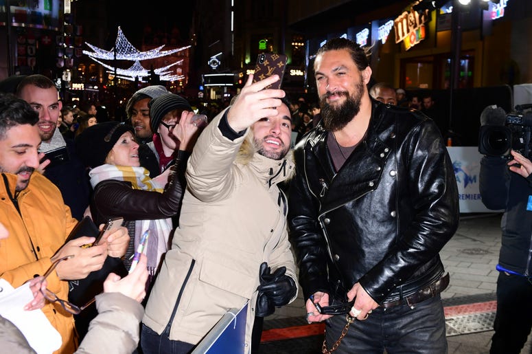Jason Momoa has a selfie taken with a fan at the Aquaman premiere held at Cineworld in Leicester Square, London. Jason Momoa has a selfie taken with a fan at the Aquaman premiere held at Cineworld in Leicester Square, London.
