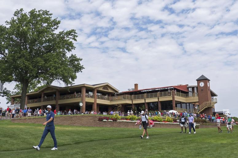 Dustin Johnson walks from the first tee box during the final round of the WGC - Bridgestone Invitational golf tournament at Firestone Country Club Dustin Johnson walks from the first tee box during the final round of the WGC - Bridgestone Invitational golf tournament at Firestone Country Club