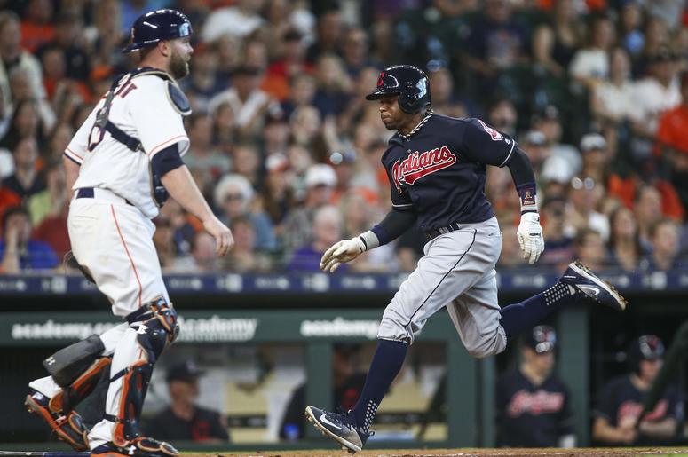 Cleveland Indians center fielder Rajai Davis (26) scores a run as Houston Astros catcher Brian McCann (16) looks on during the fifth inning at Minute Maid Park. Cleveland Indians center fielder Rajai Davis (26) scores a run as Houston Astros catcher Brian McCann (16) looks on during the fifth inning at Minute Maid Park.