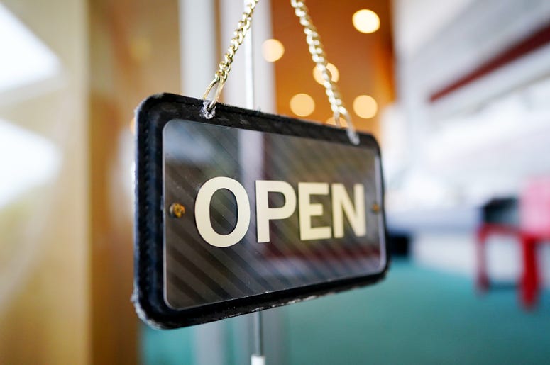 Open sign in business window Open sign in business window