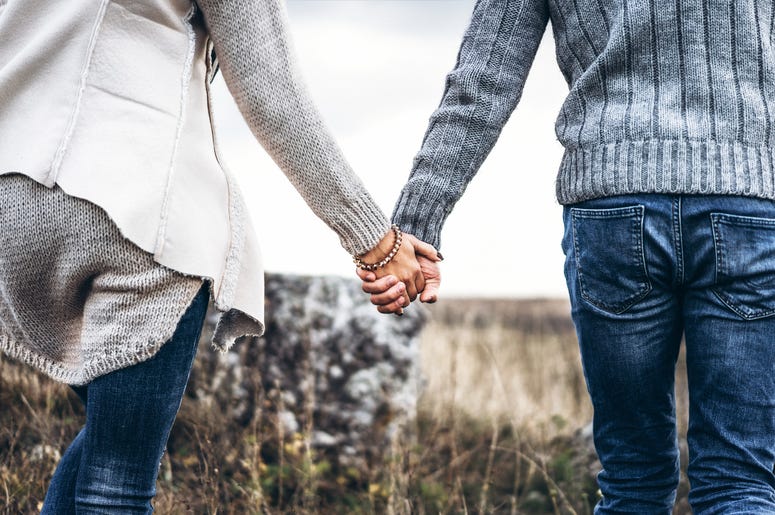 Couple holding hands