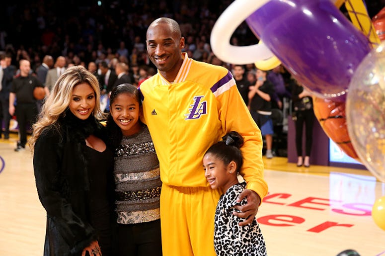 Kobe Bryant #24 of the Los Angeles Lakers poses with wife Vanessa and daughters Giana (L) and Natalia (R)