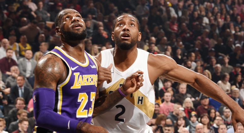 Lakers forward LeBron James and Raptors forward Kawhi Leonard