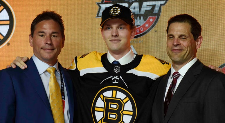 NHL: NHL Draft June 23, 2017; Chicago, IL, USA; Urho Vaakanainen poses for photos after being selected as the number eighteen overall pick to the Boston Bruins in the first round of the 2017 NHL Draft at the United Center. Mandatory Credit: David Banks-USA TODAY Sports