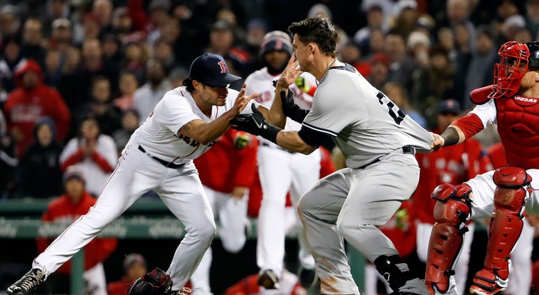 Tyler Austin charges the mound on Joe Kelly