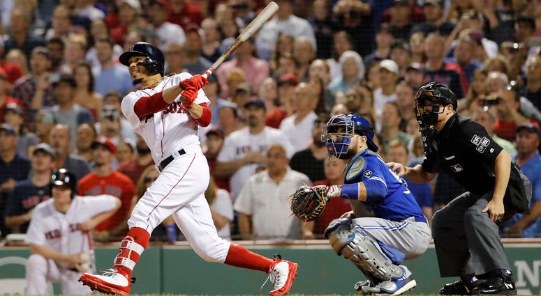 Mookie Betts hits grand slam at Fenway against Toronto Blue Jays Jul 12, 2018; Boston, MA, USA; Boston Red Sox right fielder Mookie Betts (50) hits a grand slam against the Toronto Blue Jays in the fourth inning at Fenway Park.