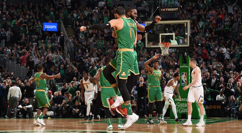 Jayson Tatum and Jaylen Brown celebrate against the Denver Nuggets