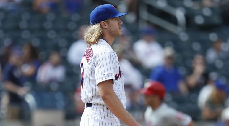 Philadelphia Phillies' Corey Dickerson, right, trots past New York Mets' starting pitcher Noah Syndergaard after hitting a solo home run during the fourth inning of a baseball game, Sunday, Sept. 8, 2019, in New York Philadelphia Phillies' Corey Dickerson, right, trots past New York Mets' starting pitcher Noah Syndergaard after hitting a solo home run during the fourth inning of a baseball game, Sunday, Sept. 8, 2019, in New York