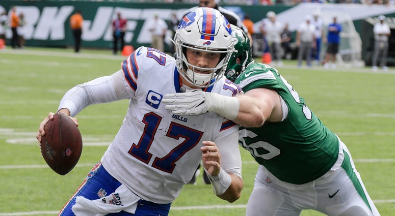 Buffalo Bills' Josh Allen (17) runs past New York Jets' Henry Anderson (96) for a touchdown during the second half of an NFL football game Sunday, Sept. 8, 2019, in East Rutherford, N.J. Buffalo Bills' Josh Allen (17) runs past New York Jets' Henry Anderson (96) for a touchdown during the second half of an NFL football game Sunday, Sept. 8, 2019, in East Rutherford, N.J.