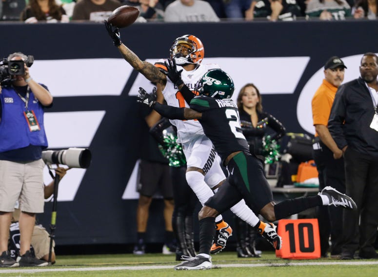 Cleveland Browns' Odell Beckham (13) catches a pass in front of New York Jets' Nate Hairston (21) during the first half of an NFL football game Monday, Sept. 16, 2019, in East Rutherford, N.J