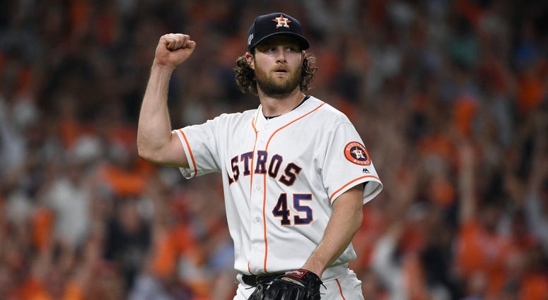 Houston Astros starting pitcher Gerrit Cole (45) reacts after an out against the Tampa Bay Rays during the seventh inning of Game 5 of a baseball American League Division Series in Houston, Houston Astros starting pitcher Gerrit Cole (45) reacts after an out against the Tampa Bay Rays during the seventh inning of Game 5 of a baseball American League Division Series in Houston,