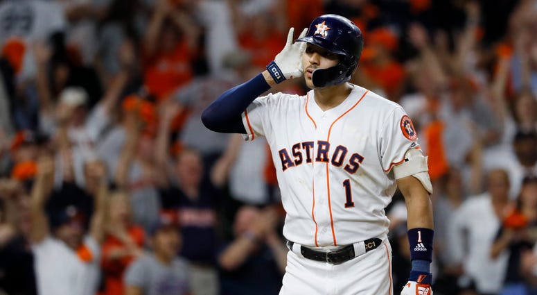 Houston Astros shortstop Carlos Correa celebrates after his walk-off home run against the New York Yankees during the 11th inning in Game 2 of baseball's American League Championship Series Monday, Oct. 14, 2019, in Houston Houston Astros shortstop Carlos Correa celebrates after his walk-off home run against the New York Yankees during the 11th inning in Game 2 of baseball's American League Championship Series Monday, Oct. 14, 2019, in Houston