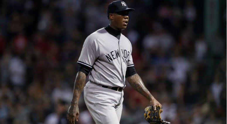 Aroldis Chapman reacts after giving up the tying run during the ninth inning against the Boston Red Sox at Fenway Park. Aroldis Chapman reacts after giving up the tying run during the ninth inning against the Boston Red Sox at Fenway Park.