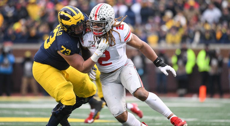 Ohio State defensive end Chase Young looks to get around Michigan offensive lineman Jalen Mayfield on Nov. 30, 2019 in Ann Arbor, Michigan. Ohio State defensive end Chase Young looks to get around Michigan offensive lineman Jalen Mayfield on Nov. 30, 2019 in Ann Arbor, Michigan.