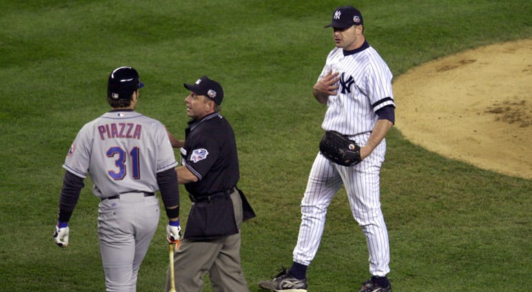 Yankees pitcher Roger Clemens (right) is separated from Mets catcher Mike Piazza (31) after Clemens threw a broken bat toward Piazza during Game 2 of the World Series on Oct. 22, 2000 at Yankee Stadium. Yankees pitcher Roger Clemens (right) is separated from Mets catcher Mike Piazza (31) after Clemens threw a broken bat toward Piazza during Game 2 of the World Series on Oct. 22, 2000 at Yankee Stadium.