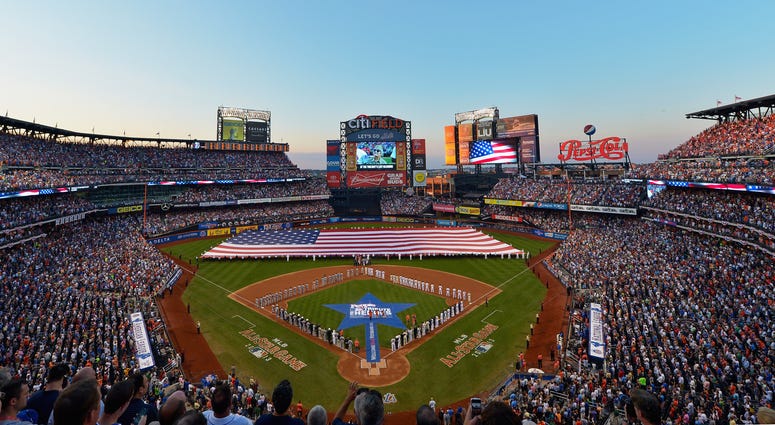 The American National Athem is sung as the flag covers the field before the 84th MLB All-Star Game on July 16, 2013 at Citi Field. Citi Field ASG
