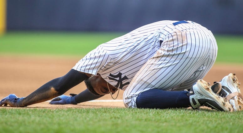 Yankees shortstop Didi Gregorius falls to the ground after a collision at first base against the Toronto Blue Jays on Aug. 19, 2018, at Yankee Stadium. Yankees shortstop Didi Gregorius falls to the ground after a collision at first base against the Toronto Blue Jays on Aug. 19, 2018, at Yankee Stadium.