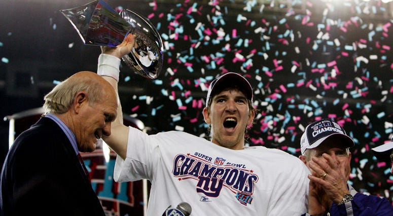 Giants quarterback Eli Manning holds the Vince Lombardi Trophy after defeating the New England Patriots 17-14 in Super Bowl XLII on Feb. 3, 2008, at University of Phoenix Stadium in Glendale, Arizona. Giants quarterback Eli Manning holds the Vince Lombardi Trophy after defeating the New England Patriots 17-14 in Super Bowl XLII on Feb. 3, 2008, at University of Phoenix Stadium in Glendale, Arizona.