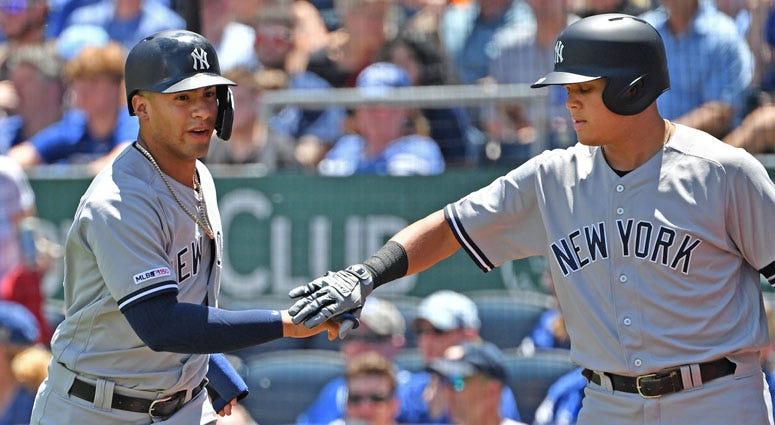 Yankees shortstop Gleyber Torres celebrates with teammate Gio Urshela after scoring a run on May 26, 2019, against the Royals in Kansas City, Missouri. Yankees shortstop Gleyber Torres celebrates with teammate Gio Urshela after scoring a run on May 26, 2019, against the Royals in Kansas City, Missouri.