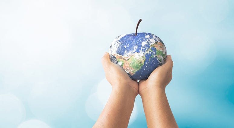 Earth as an apple in child's hands